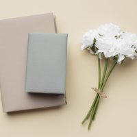 arrangement-with-books-white-flowers-min